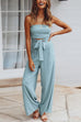 Tuta da resort Kelsidress con spalle scoperte e papillon in vita