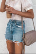 Pantaloncini Kelsidress Street Style con orlo grezzo strappati e tasche